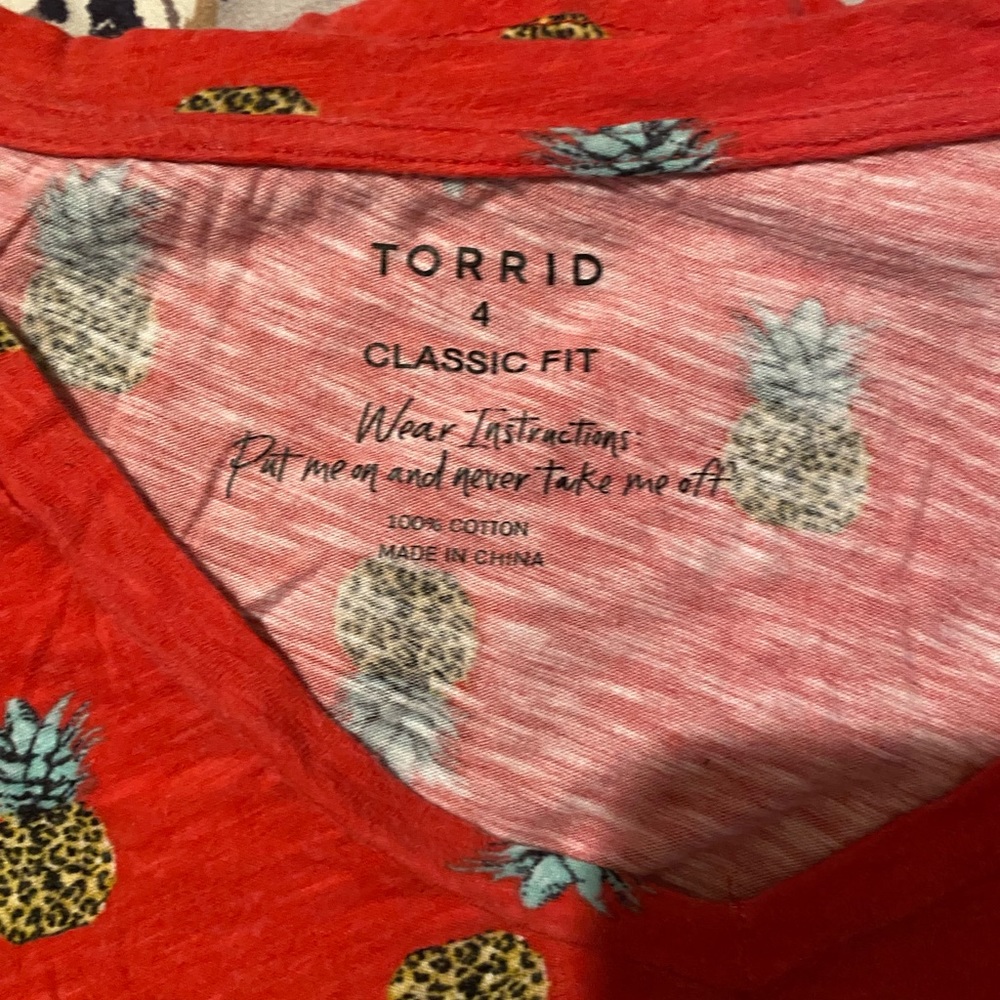 Torrid classic fit T shirt with front pocket, pineapple print. Size 4
